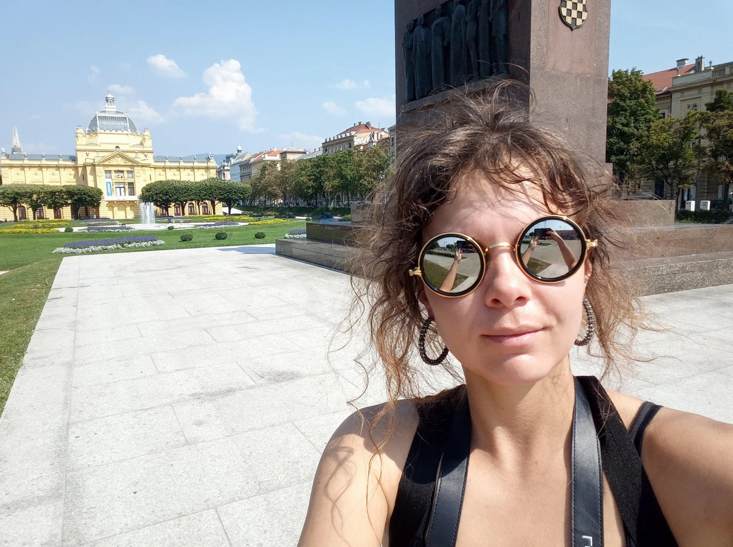 Rozzebud wearing round sunglasses in Zagreb, Croatia, in 2019